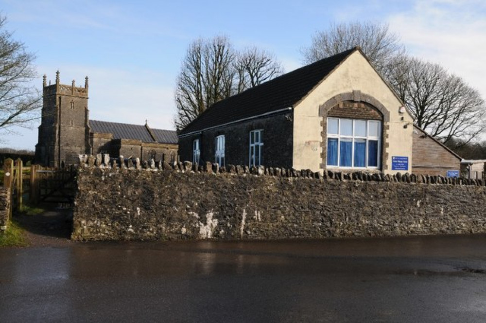 The primary school in Priddy with St Lawrence's church immediately behind. © Copyright Philip Halling and licensed for reuse under Creative Commons Licence.