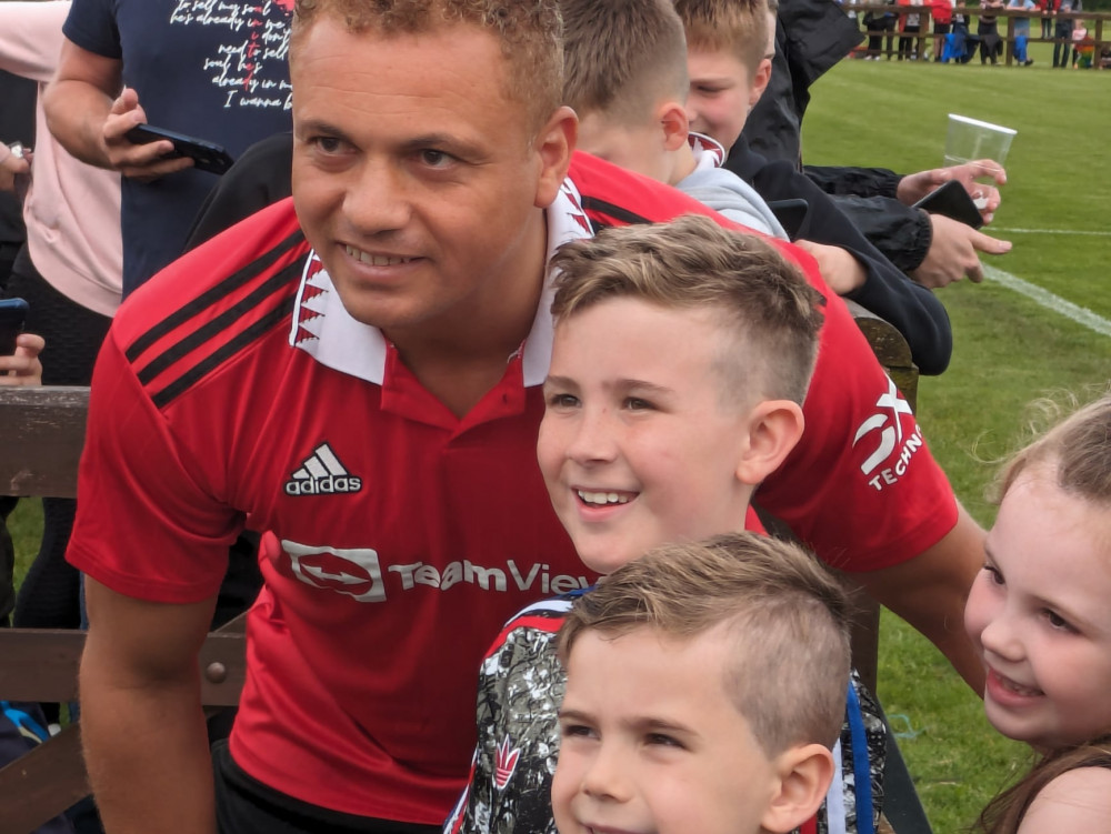 Young football fans got players' autographs including Wes Brown's. (Photo: Nub News)