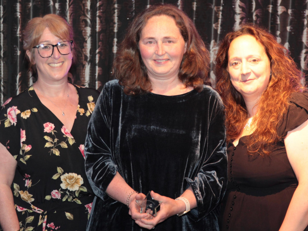 Jo Wheeler (centre) has been recognised with the Pioneer award for her amazing contribution to Dorset's children and young people