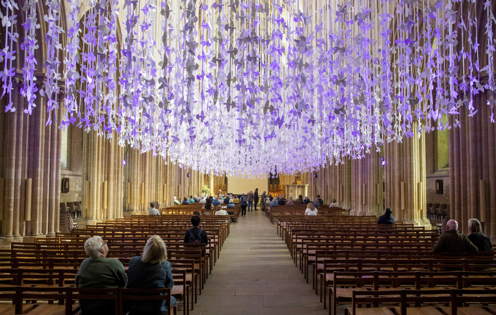 Thousands of paper doves installed high above the nave at Wells Cathedral (SWNS) Thousands of paper doves installed high above the nave at Wells Cathedral (SWNS)