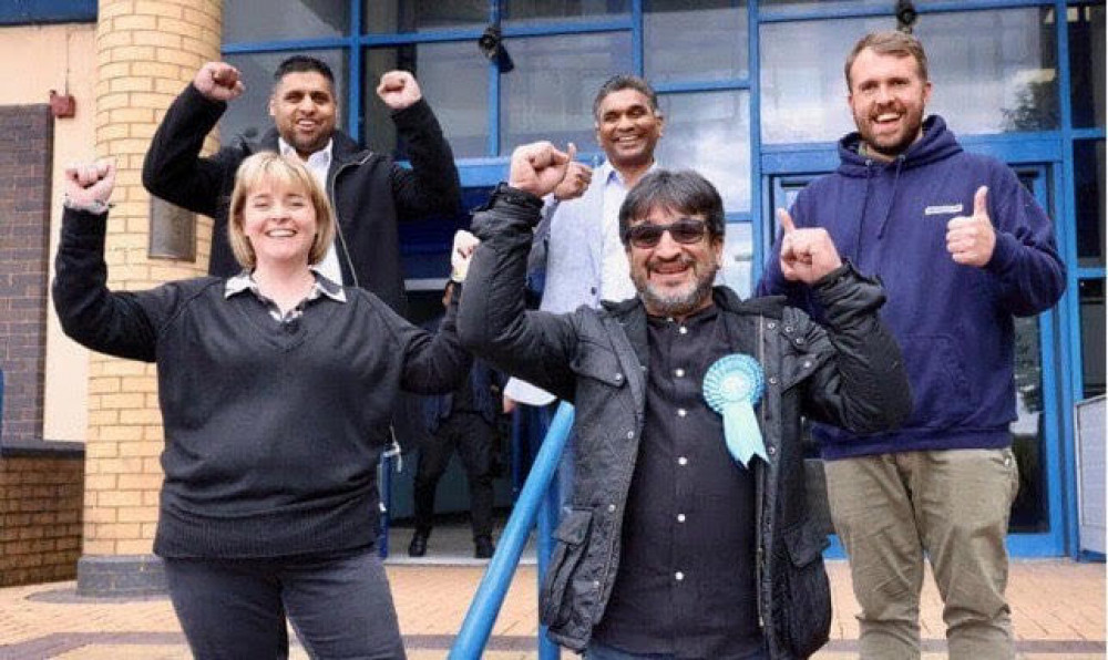 Yasser Hussain (far left at the back) has been pictured with Conservative party members (Pete Stonier).