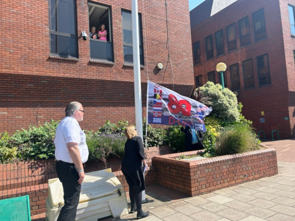 Mayor Cllr Kairen Raper raised the D-Day flag.  Mayor Cllr Kairen Raper raised the D-Day flag.