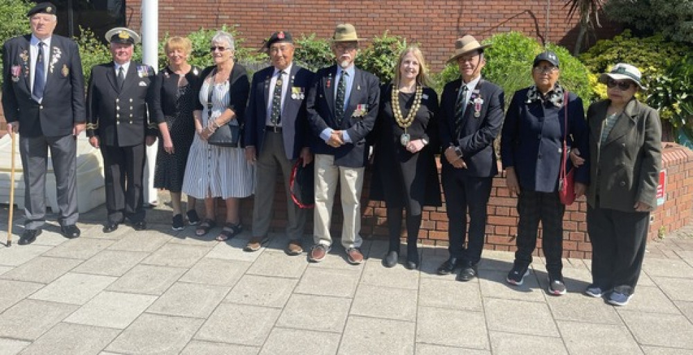 Borough Mayor Cllr Kairen Raper with veterans at the flagraising in Grays. Borough Mayor Cllr Kairen Raper with veterans at the flagraising in Grays.
