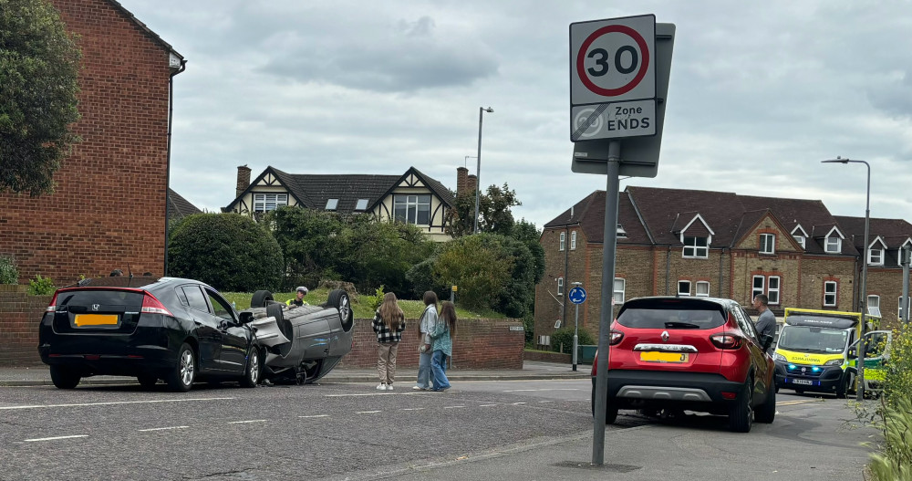 The road was blocked by police but youngsters went close to look inside the overturned vehicle. 