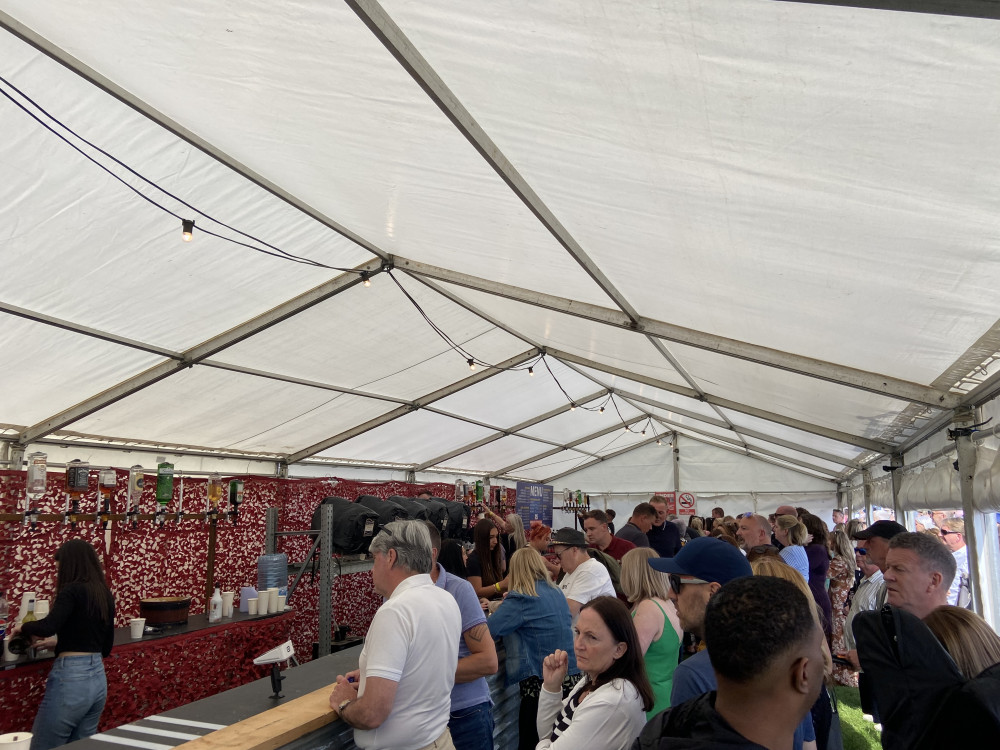 The bars were very popular as revellers queued for a pint in the sun. (Photo: Chloe Brewster)