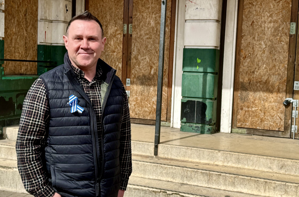 Cllr Michael Wyatt outside the former Rex Cinema in Coalville. Photo: Coalville Nub News