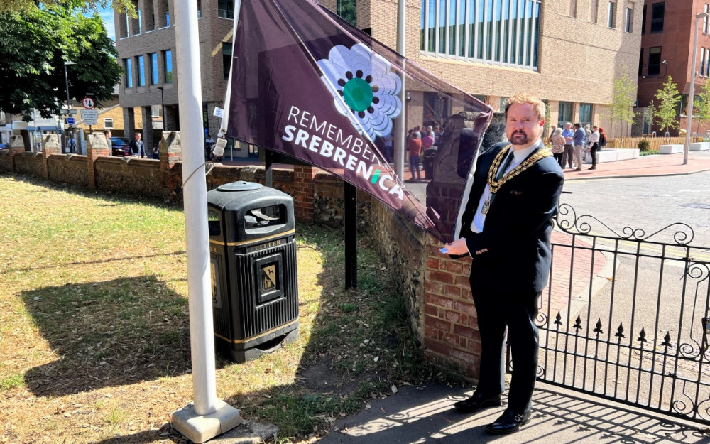 A previous Mayor, Cllr James hadlen, with the Srebrenica flag. 