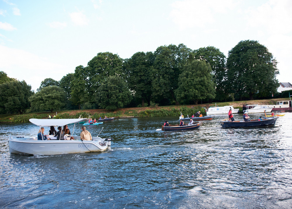 The confused passengers of a rented Goboat pleasure craft gets caught up in the celebrations. (Photo: Oliver Monk)