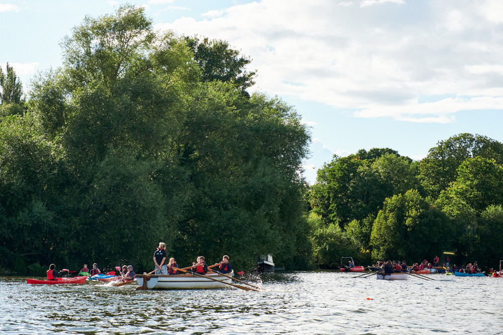 Some participants don't have the luxury of an outboard motor, instead rowing themselves to the meeting point. (Photo: Oliver Monk)