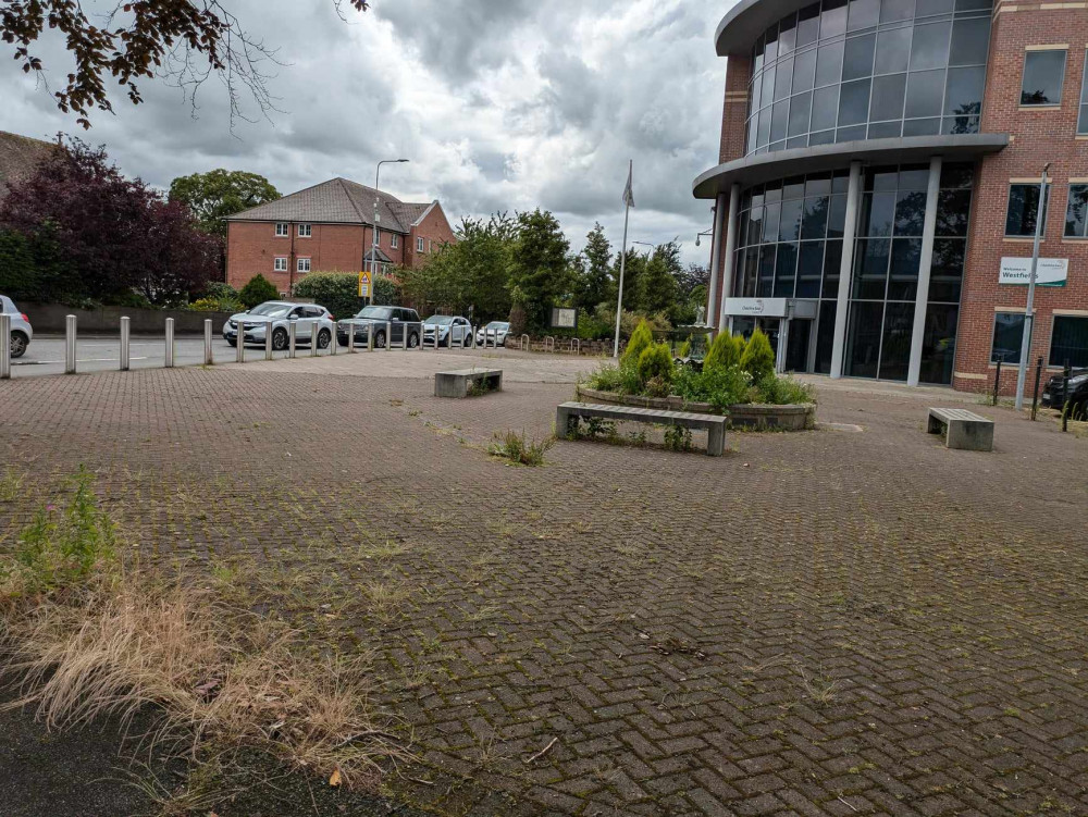 Readers have complained about the unkempt state of the area in front of Cheshire East's Westfields building in Sandbach. (Photo: Nub News) 