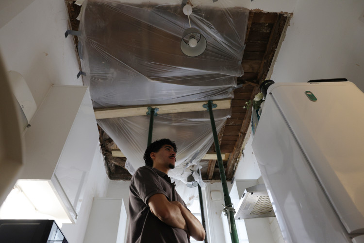 Cesar Medina in his damaged kitchen in Acton, west London (credit: Facundo Arrizabalaga/MyLondon).
