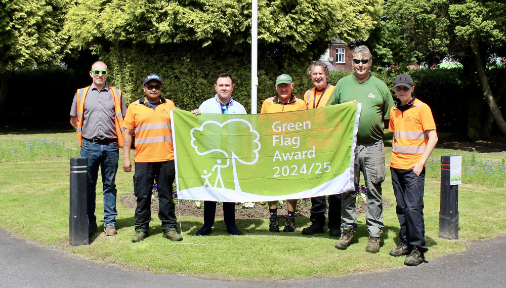 The parks team (including cemetery staff) and Councillor Michael Wyatt with the Green Flag Award. Photos: North West Leicestershire District Council