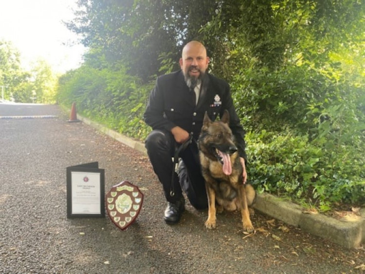 PC Stuart Oram and his canine companion PD Bren have been rewarded for their outstanding crime fighting work across Stockport and Greater Manchester (Image - GMP)
