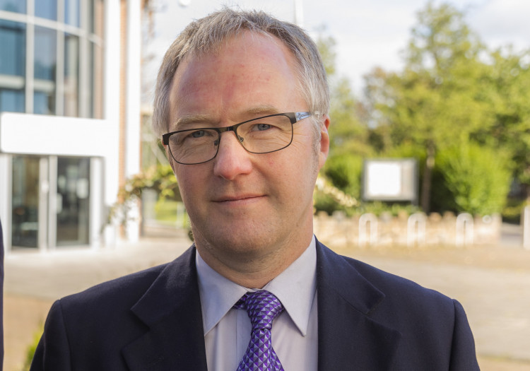 Cllr Sam Corcoran, pictured when he was leader of Cheshire East Council, outside their Westfields HQ. (Image - Cheshire East Council)