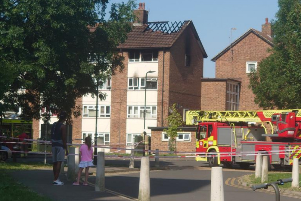 The aftermath of the fire to the roof of a block of flats in Newmarket Avenue, Northolt (credit: @KlymkoNataliya/X). 