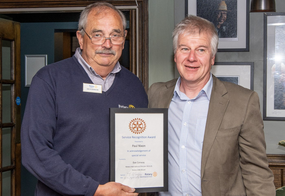 Rotary-Congleton president-elect Ian Robinson presents the award to Paul Nixon (Image supplied)