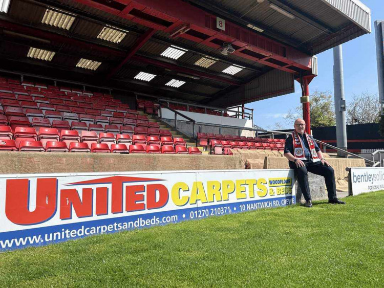 Owner of United Carpets, Nantwich Road, Eddie Davies, by his new side-side board at Crewe Alex (Nub News).