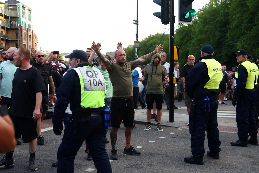 Police in Bristol on Sunday, 4 August as protest turn violent (credit: SWNS). Police in Bristol on Sunday, 4 August as protest turn violent (credit: SWNS).