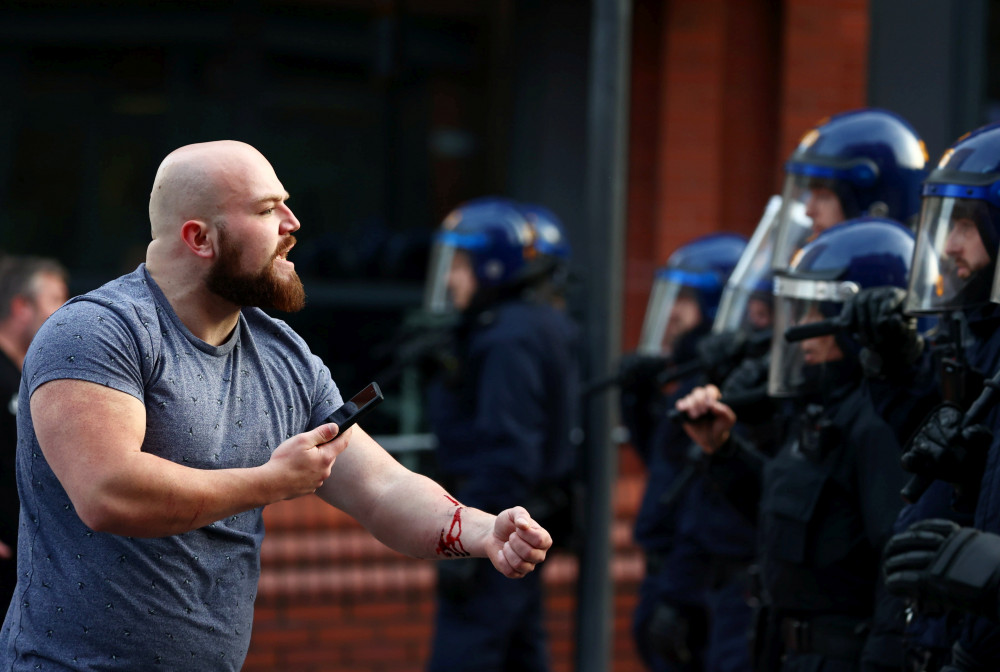 Police in Bristol on Sunday, 4 August as protest turn violent (credit: SWNS).