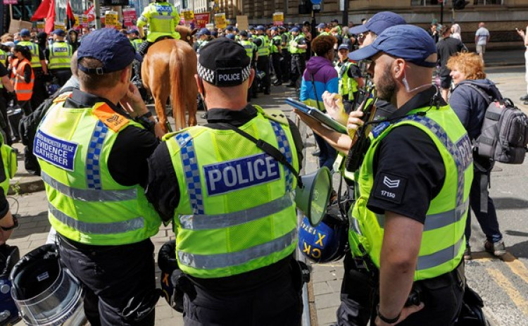 Police dealt with riots in Manchester on the weekend of 3-4 August - three men from Stockport have been charged in relation (Image - GMP)
