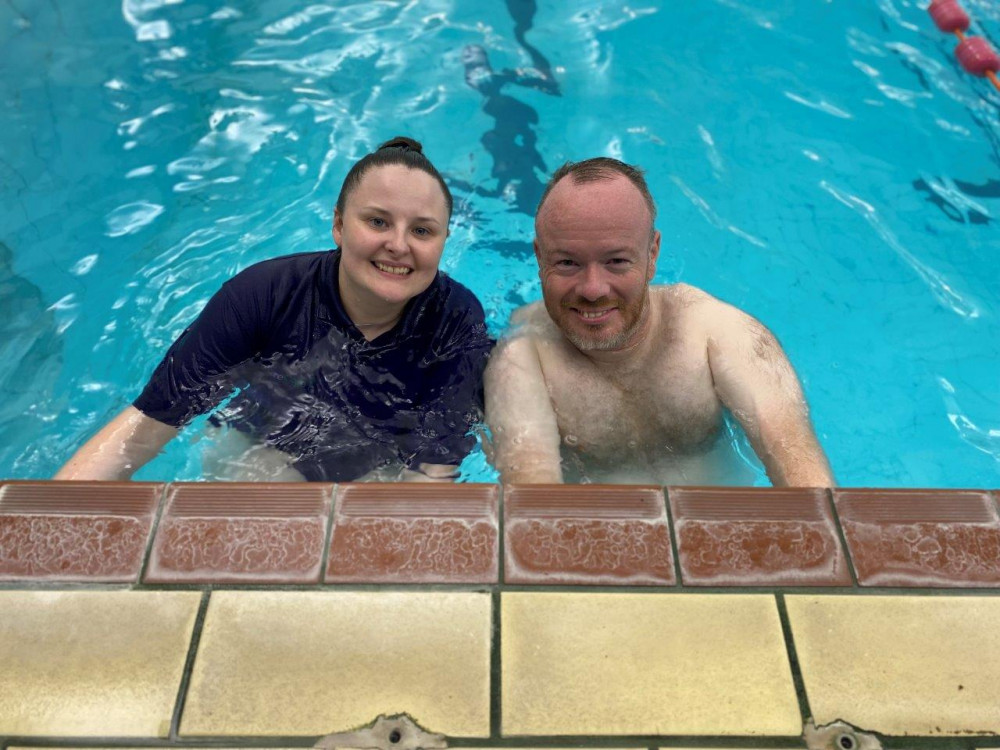 Bart Gee, 42, being supported at swimming by Jess from SureCare Central Cheshire (Nub News).