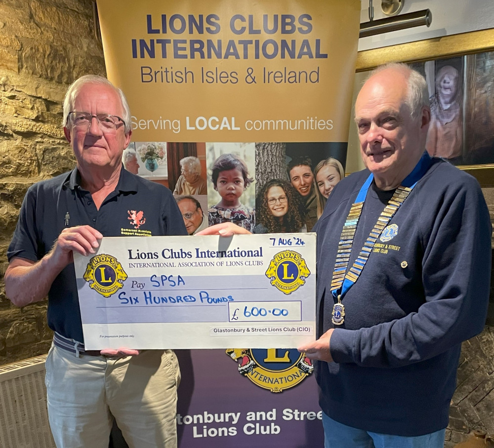 Peter Hopwood, Chair of the Somerset Prostate Support Association, receives a cheque from Lion President Derek Green of Glastonbury and Street Lions Club (CIO). (Submitted) 