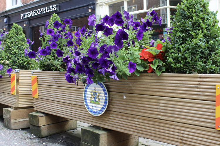 The Macclesfield Town Council logo, on a planter on Market Place. (Image - Macclesfield Nub News) 
