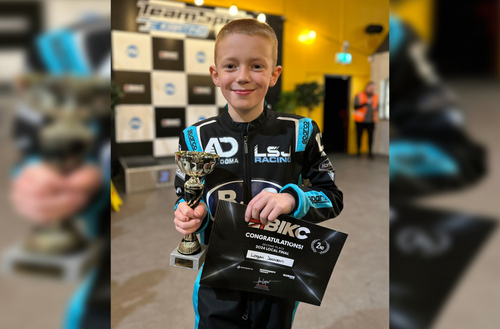 Logan Jackson with his most recent trophy and certificate. (Image - Nicola Jackson)