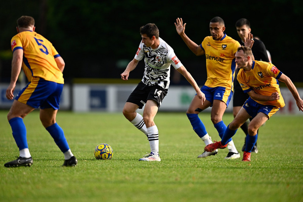 No way through - story of the day as Tilbury sub Kieran Jones is crowded out. Picture by Paul Bocking, InFocus Photos.