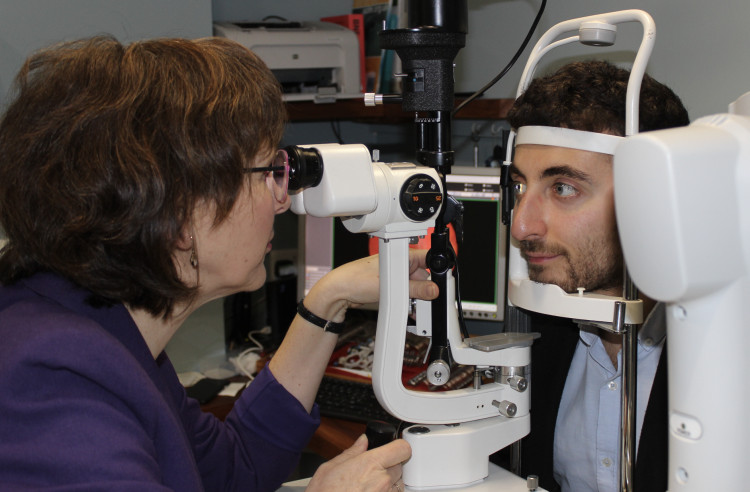 Sarah Clarke (left) of Park Lane Opticians undertakes an eye exam. (Image - Macclesfield Nub News) 