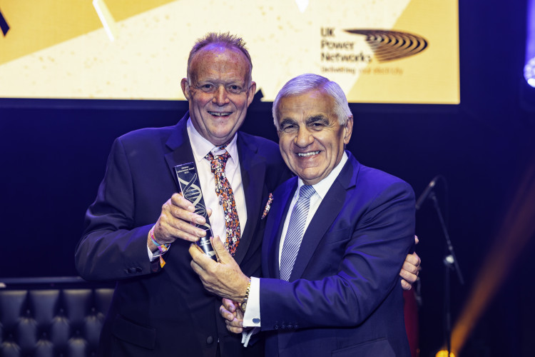 UK Power Networks training specialist, Lee Perkins from Tolworth, celebrates a lifetime achievement award with chief executive Basil Scarsella (Credit: Uk Power Networks)