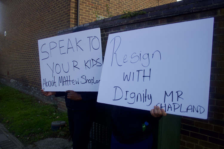 Protestors held signs outside of the Ealing primary school voicing their concerns on Monday, 7 October (credit: Cesar Medina).