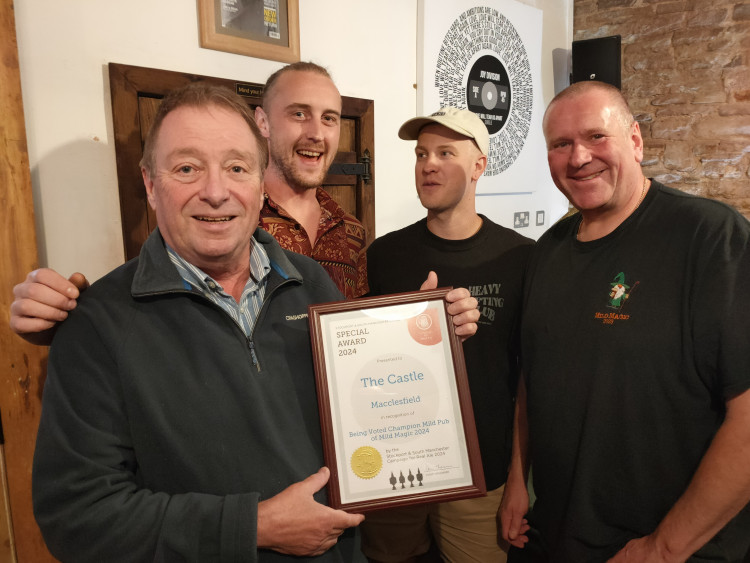 Darren Berry (right), with (from left to right) The Castle Macclesfield regular Kevin Rothwell, and bar team members Dave Dooley and Tommy Lewis. (Image - @MECCAMRA / Stockport and South Macclesfield CAMRA)