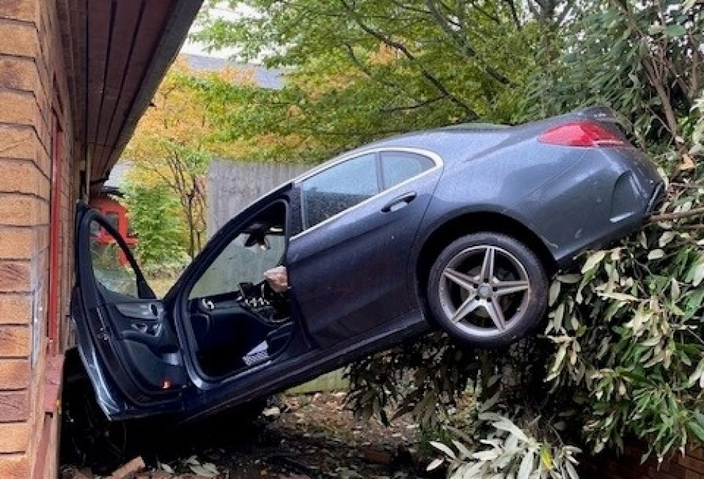 The vehicle was found crashed into the side of the building (image via Warwickshire OPU)