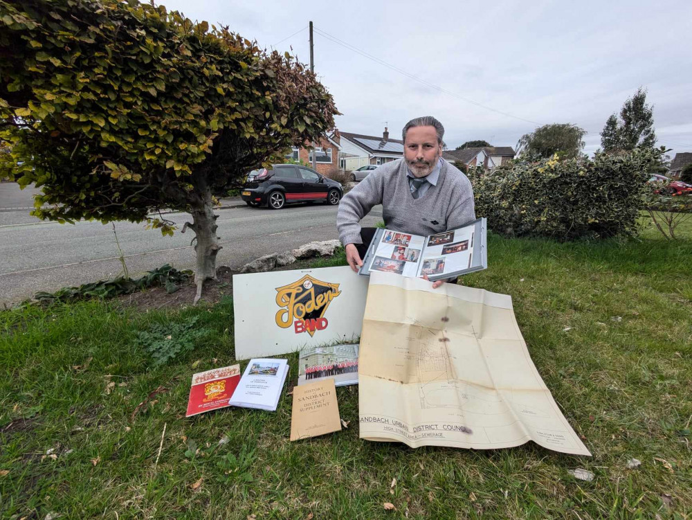 Stewart, usually the other side of the camera, with some of the items from Saturday's display. (Photo: Nub News)