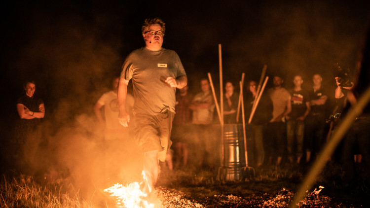 Chris Jones from the Mission: Impossible 8 film walking on hot coals with flames (credit: Image supplied).