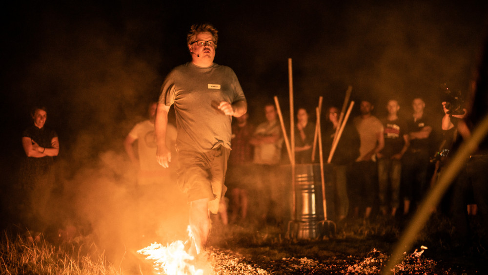 Chris Jones from the Mission: Impossible 8 film walking on hot coals with flames (credit: Image supplied).