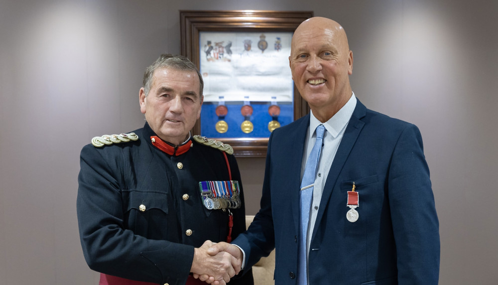 Vice Lord-Lieutenant of Leicestershire, Colonel Murray Colville presents the BEM to Mark Storer from Coalville. Photo: Leicestershire County Council