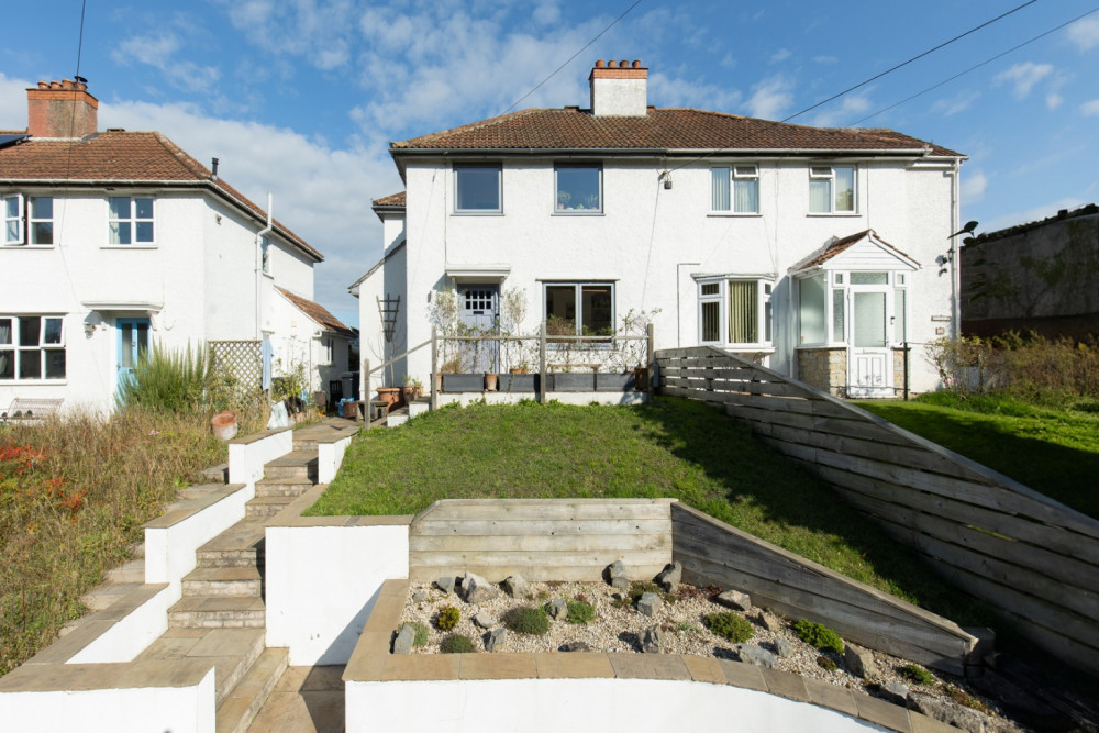  This stunning four-bed family home in Wedmore offers open-plan living, countryside views, and a spacious garden with a versatile studio space.