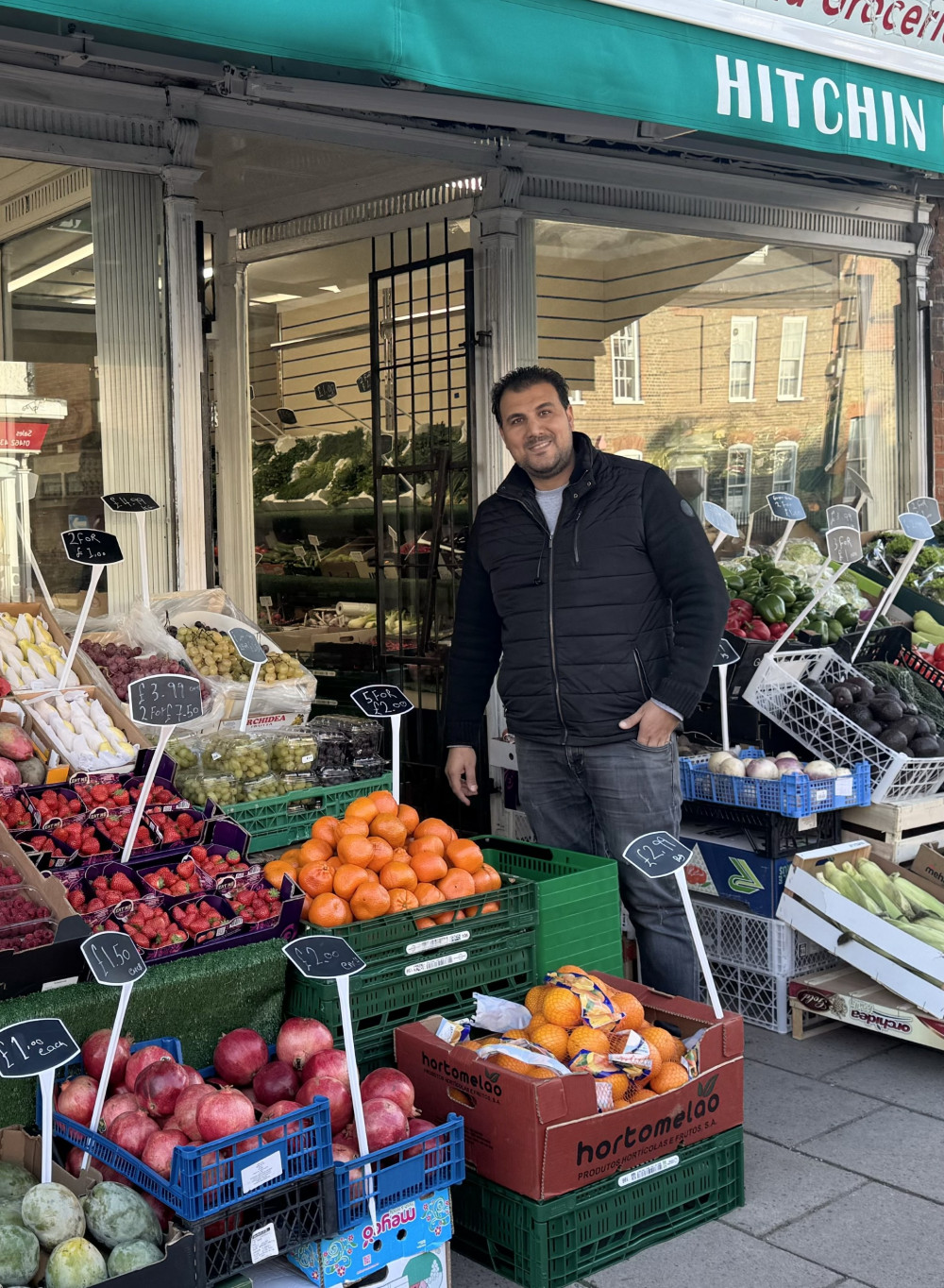 Mustafa, the new owner, outside "Hitchin Bazaar"