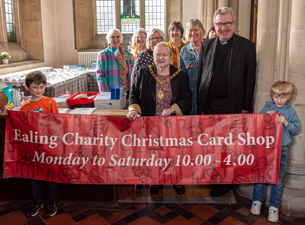 (Front left to right) James Ellis, Councillor Yvonne Johnson, Sue Green, Father Richard Collins and Ben Ellis holding the Christmas card shop banner during its opening on 29 October 2024 (credit: Image supplied).