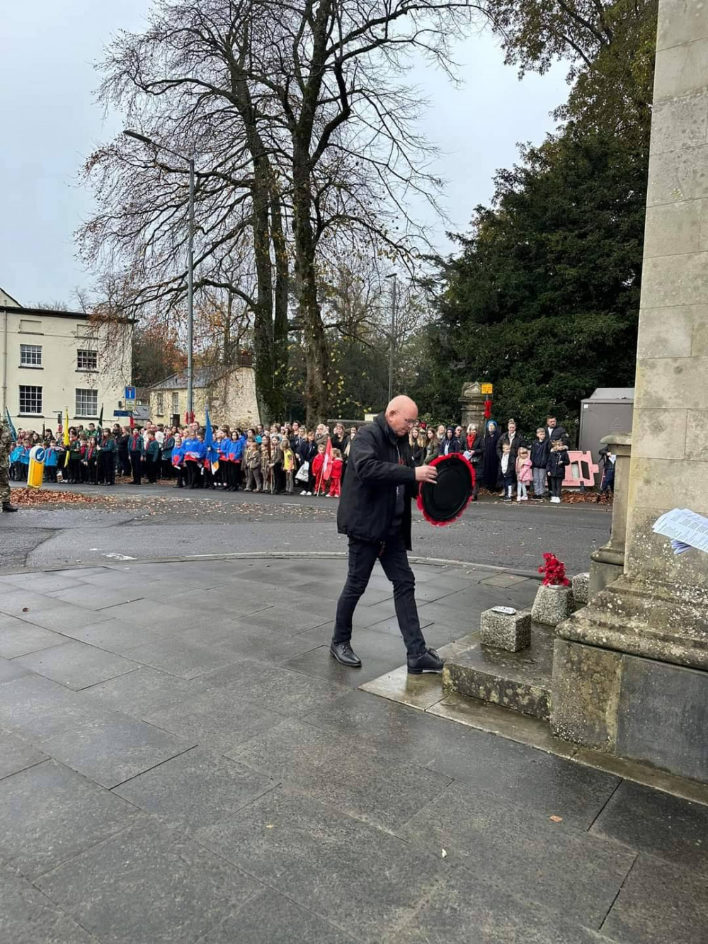 A wreath being laid at Shepton Mallet Cenotaph. 