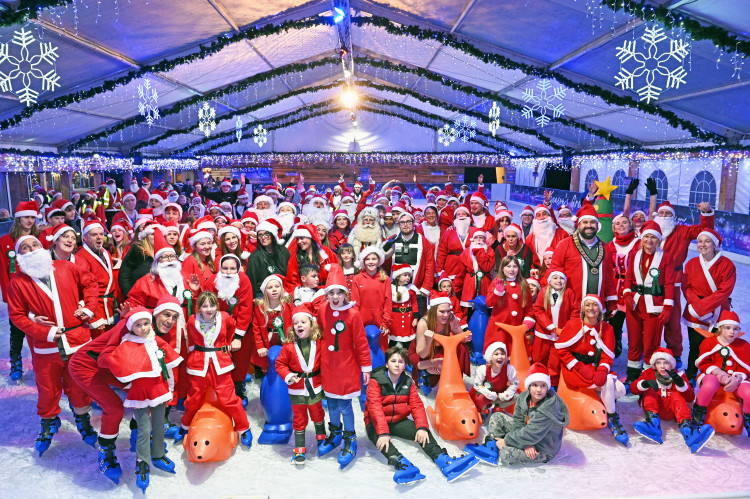 Santas take to the ice at Clarks Village, marking the launch of the festive ice rink with a record-breaking skate.