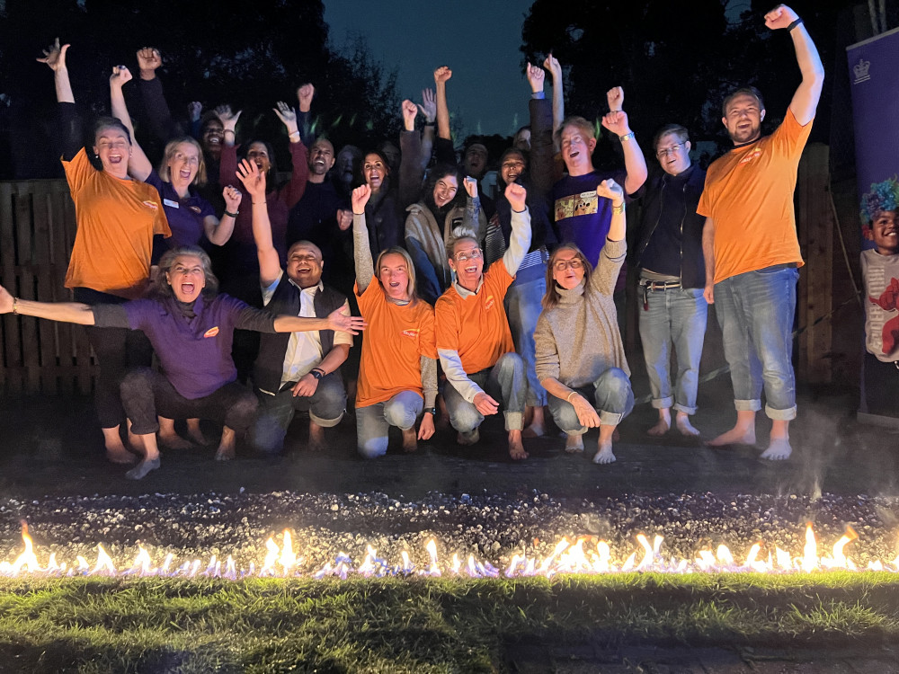 Members from Skylarks and local residents completed the Firewalk to raise money for the charity (credit: Skylarks Charity). 