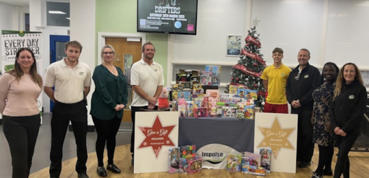 Cllr Vikki Hartstean, third from left, with staff at Impulse Leisure.