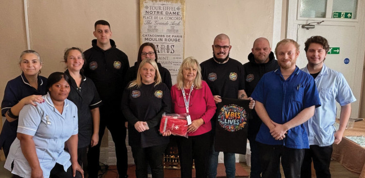 Cllr Sue Sammons with members of ‘Vibes Not Lives’, Lemzstudios representatives and staff at  Merrie Loots