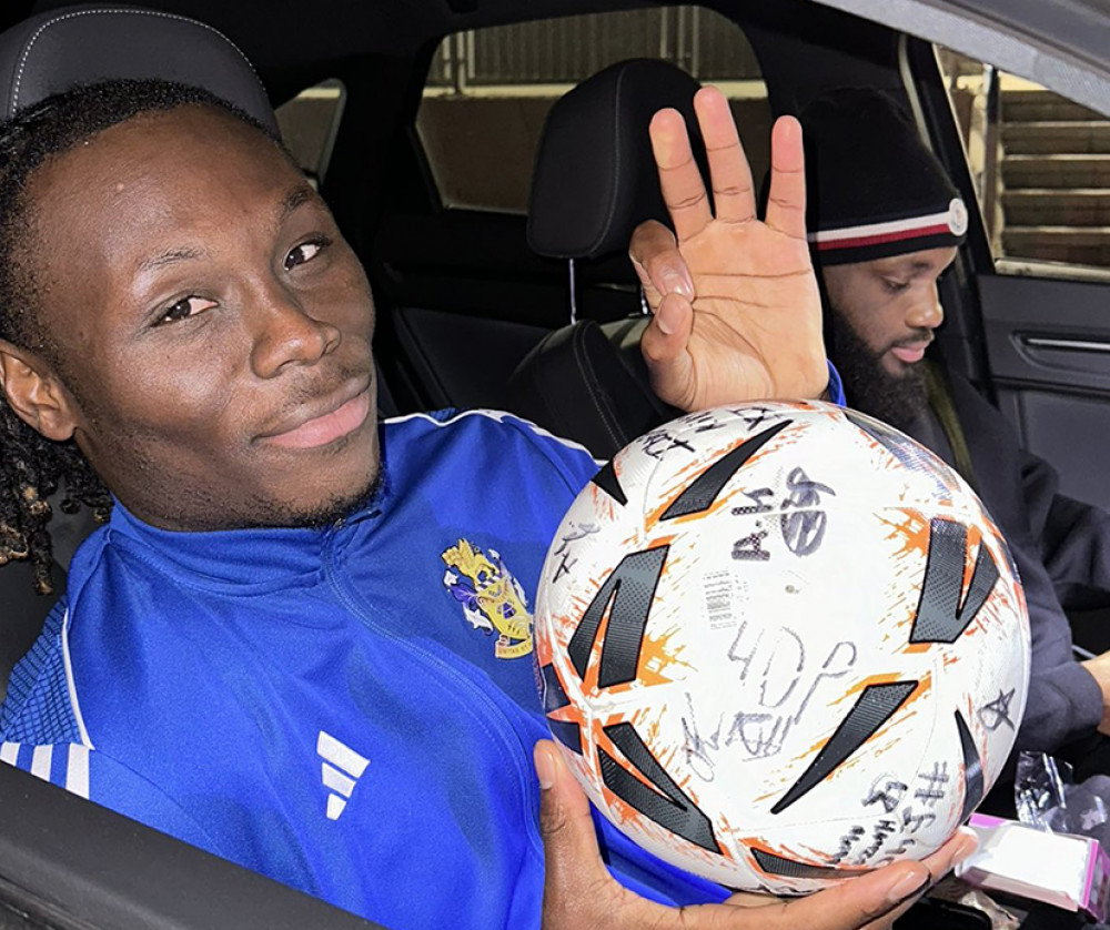 Razzaq Coleman-De-Graft with a signed match ball.