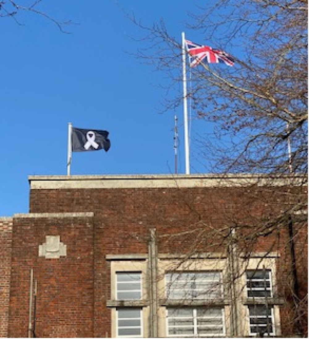 White ribbon flag flying over County Hall in Dorchester