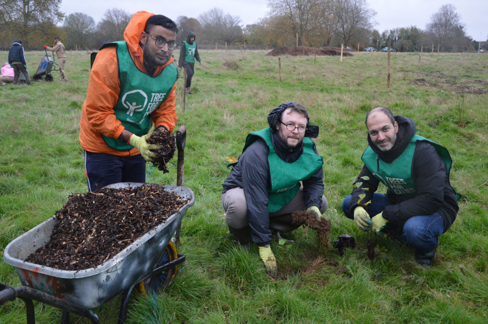 London Assembly Member Bassam Mahfouz (right) planting trees with members from Trees for Cities (credit: Image supplied).