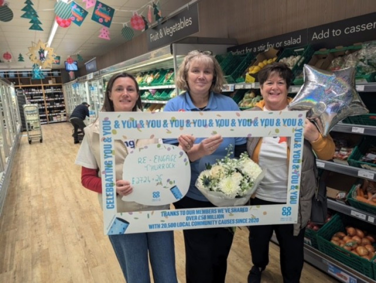 Clarissa Wood and Paula Mullooly from Re-engage flank Clare Mason at the Co-op. 